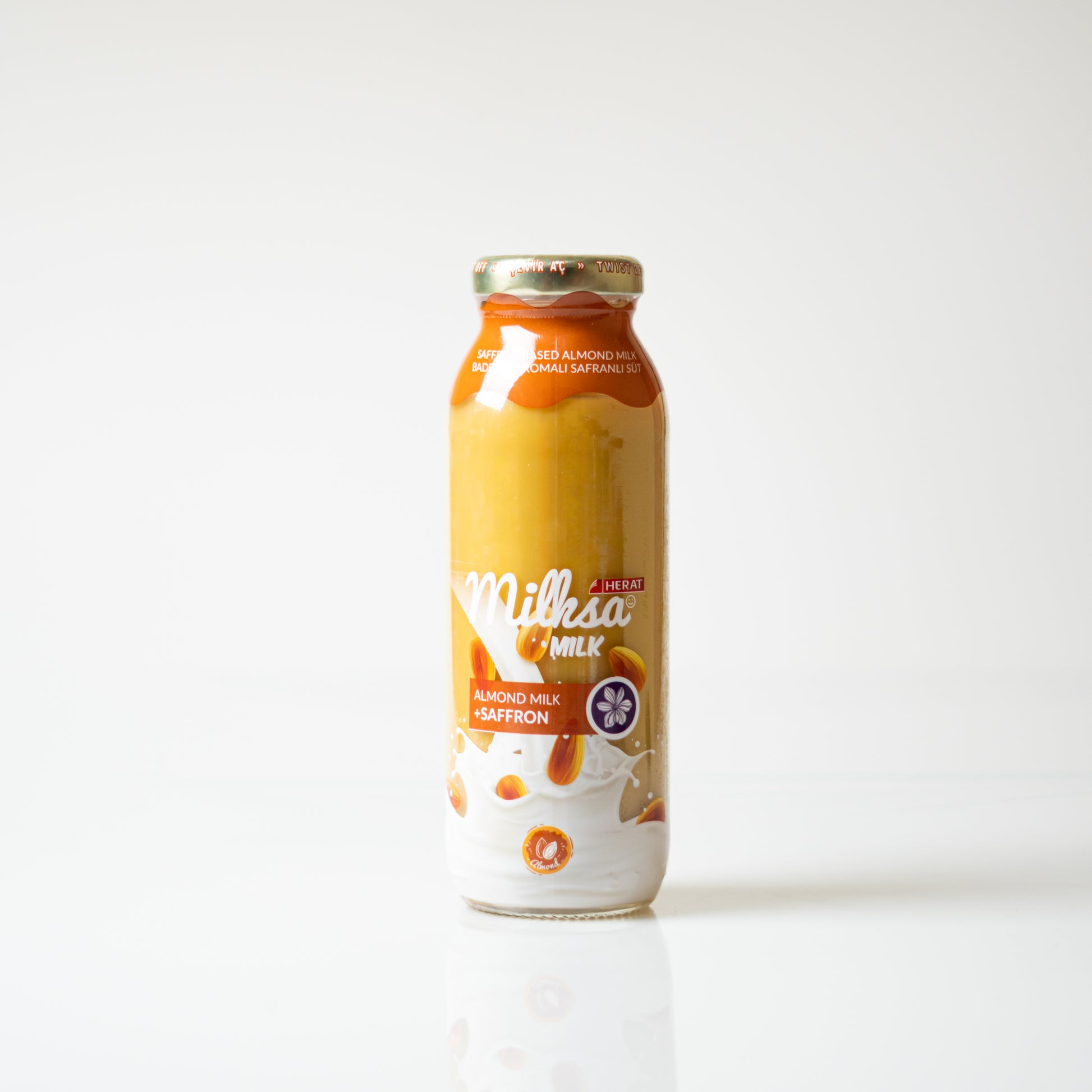 Bottle of Milksa almond milk with saffron on a white background