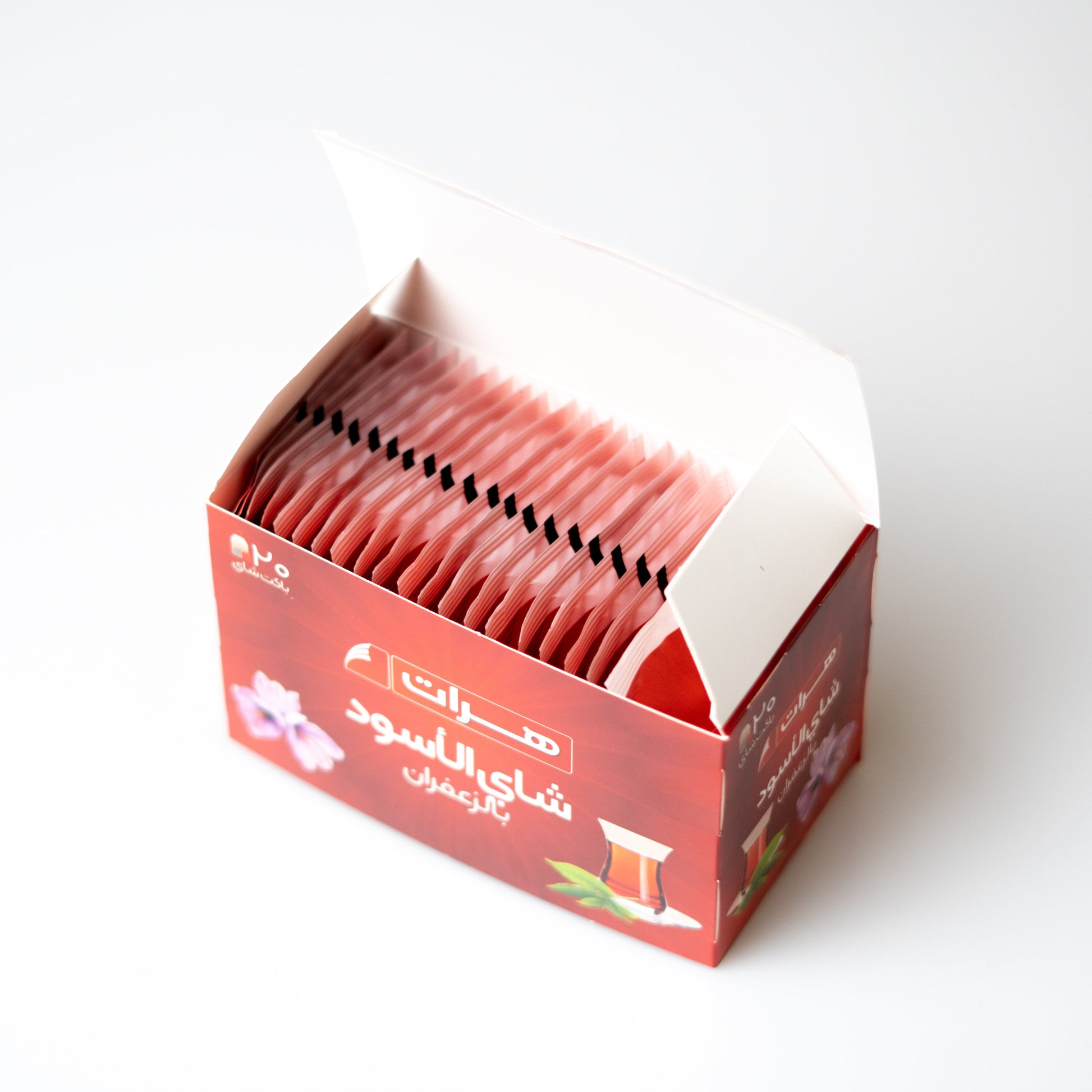 Box of tea bags with Arabic text on a white background