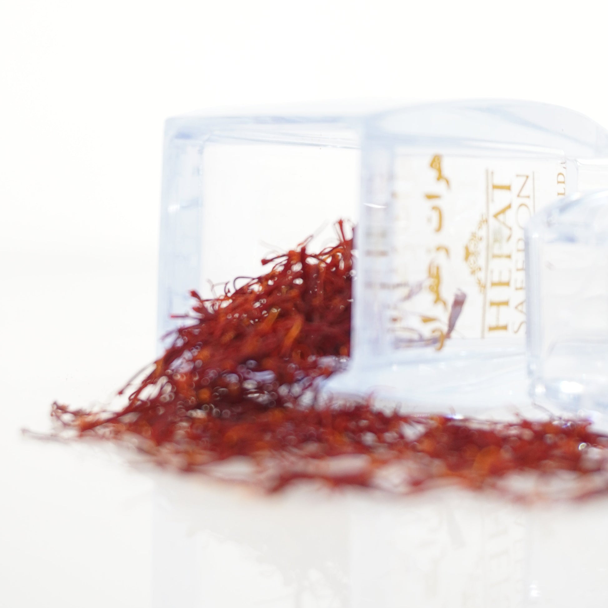 Saffron threads in a clear package on a white background