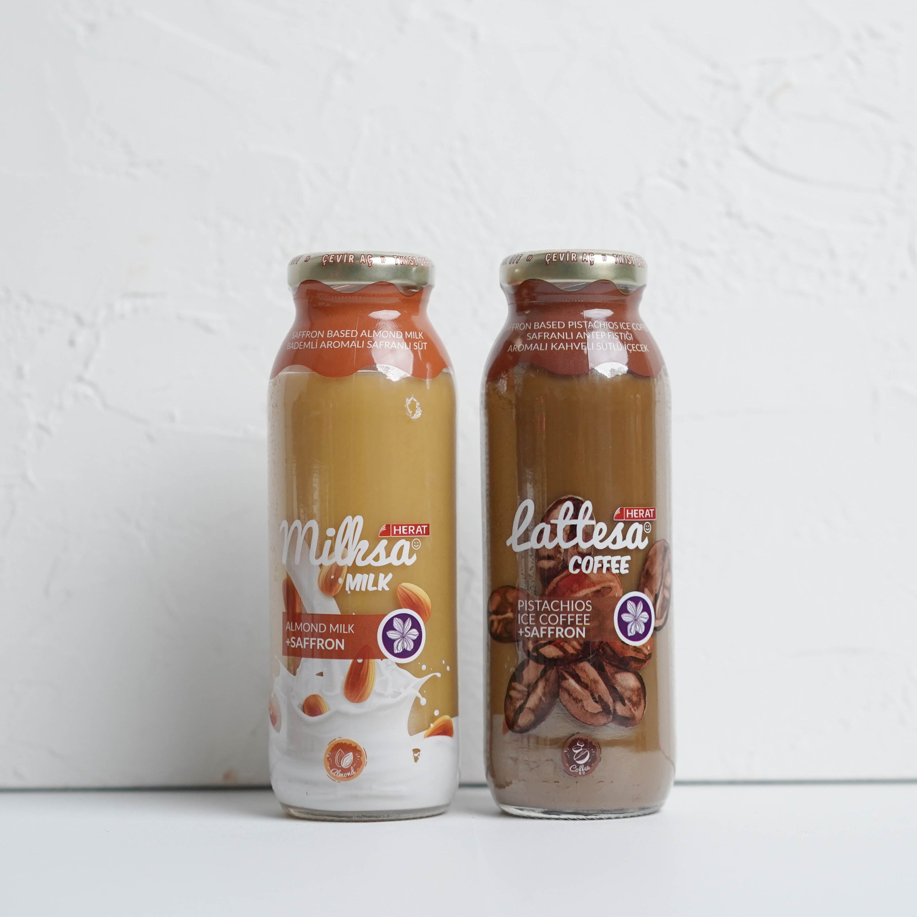 Two bottles of milk and coffee on a white background
