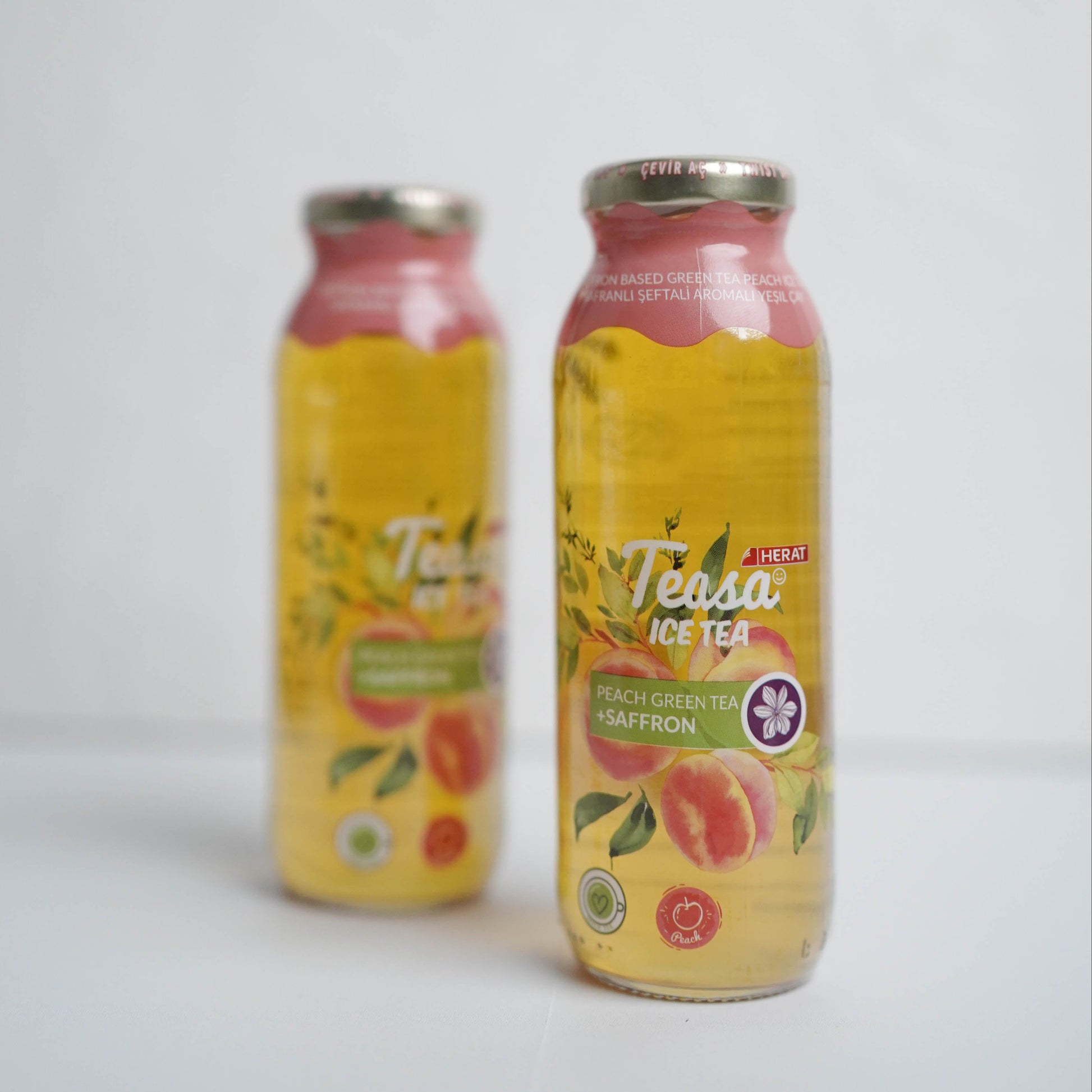 Two bottles of Tessa ice tea on a white background
