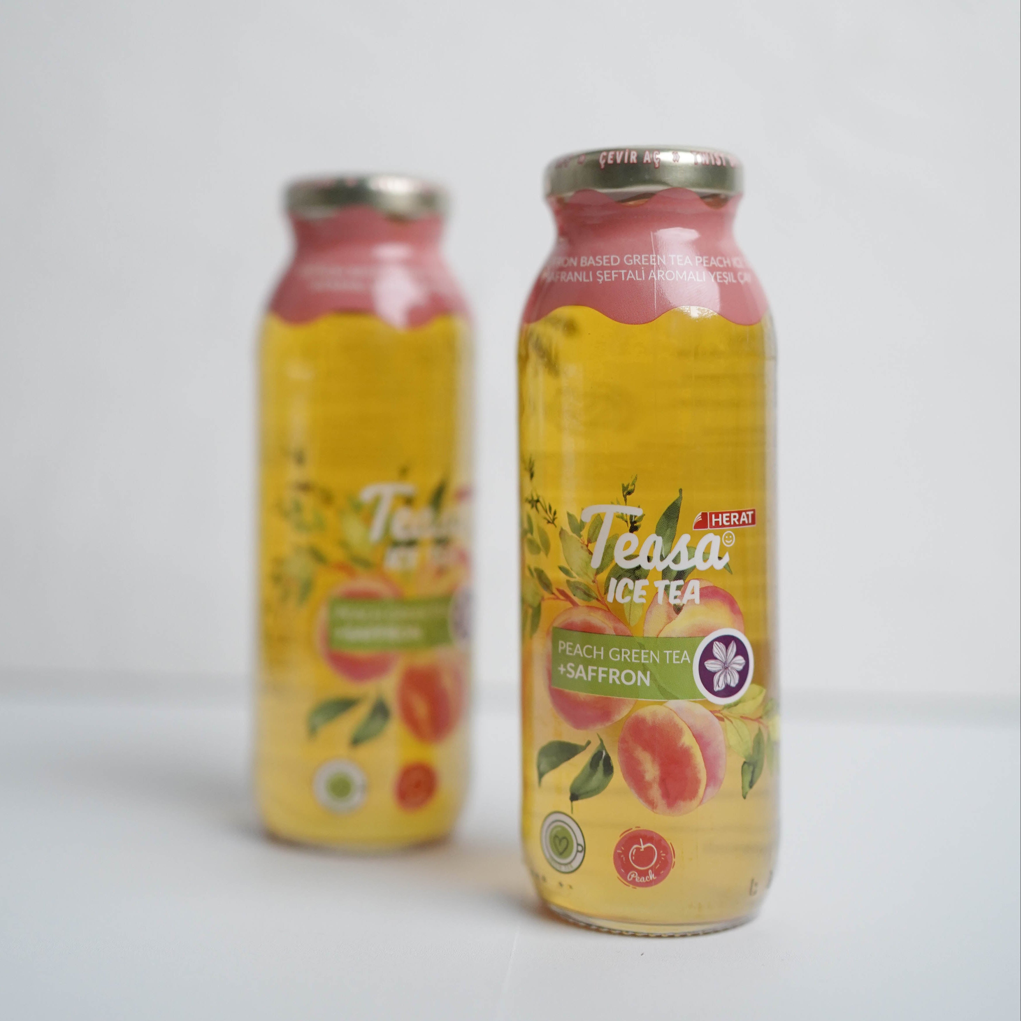 Two bottles of Tessa ice tea on a white background