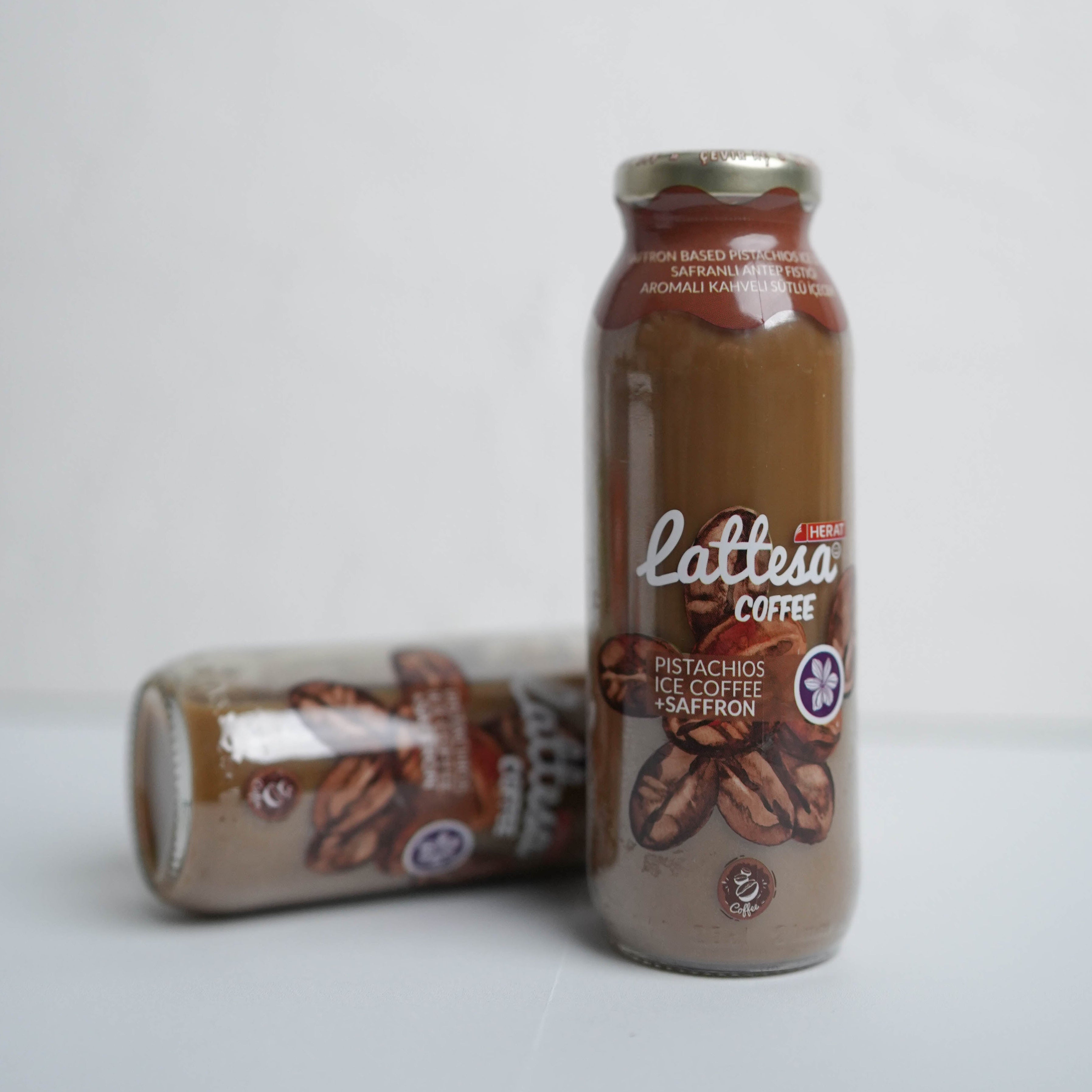 Lattesa coffee bottle and can on a white background