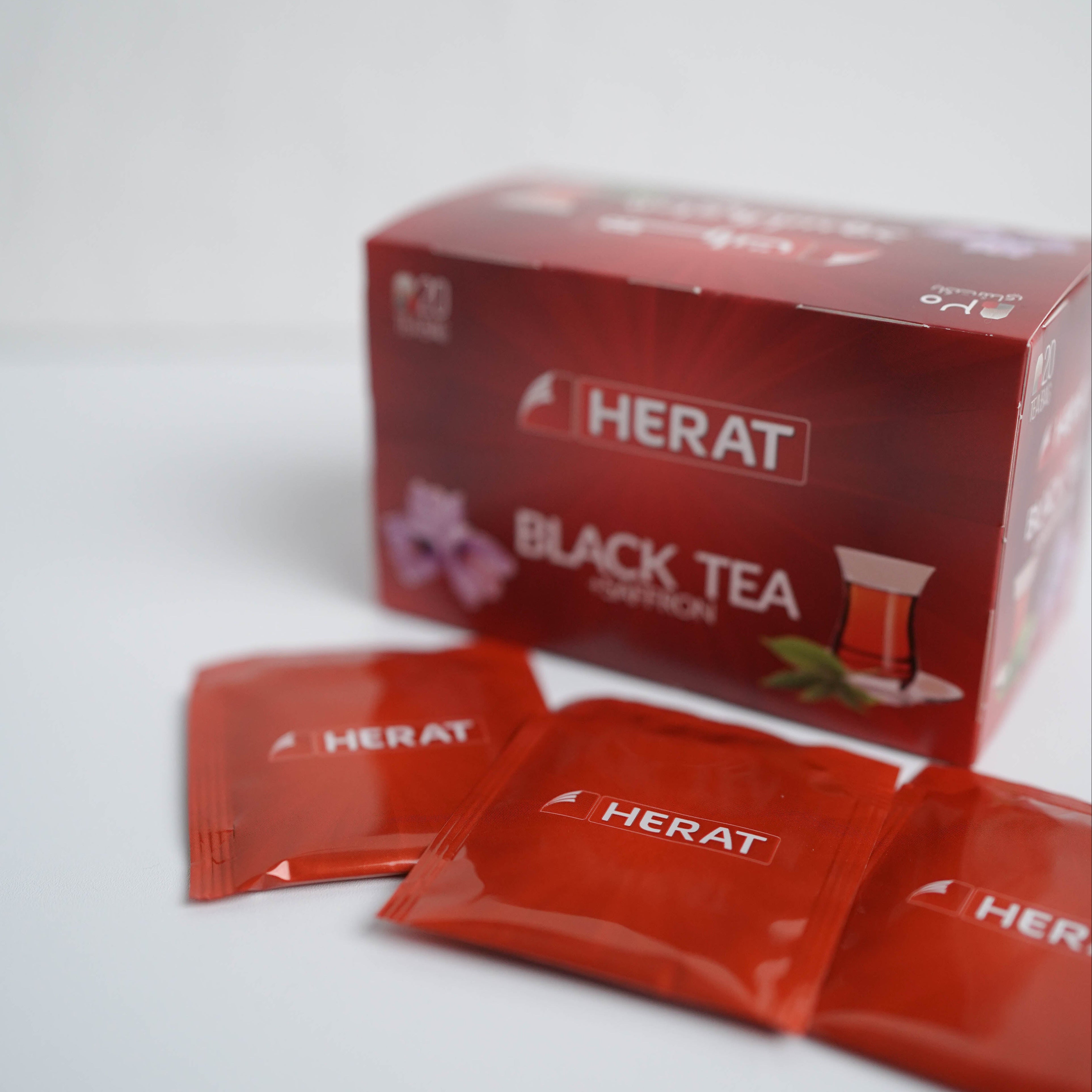 HERAT Black Tea packets on a white background