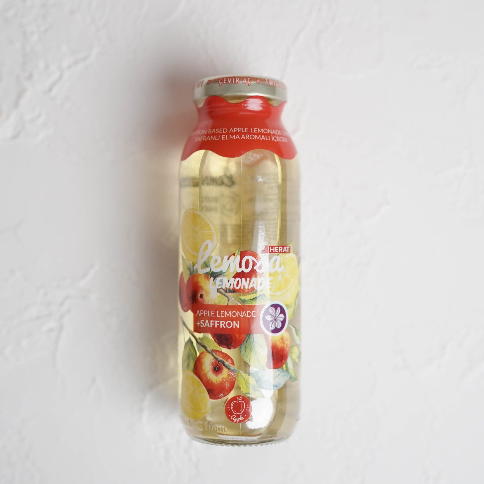 Bottle of lemonade on a light gray background