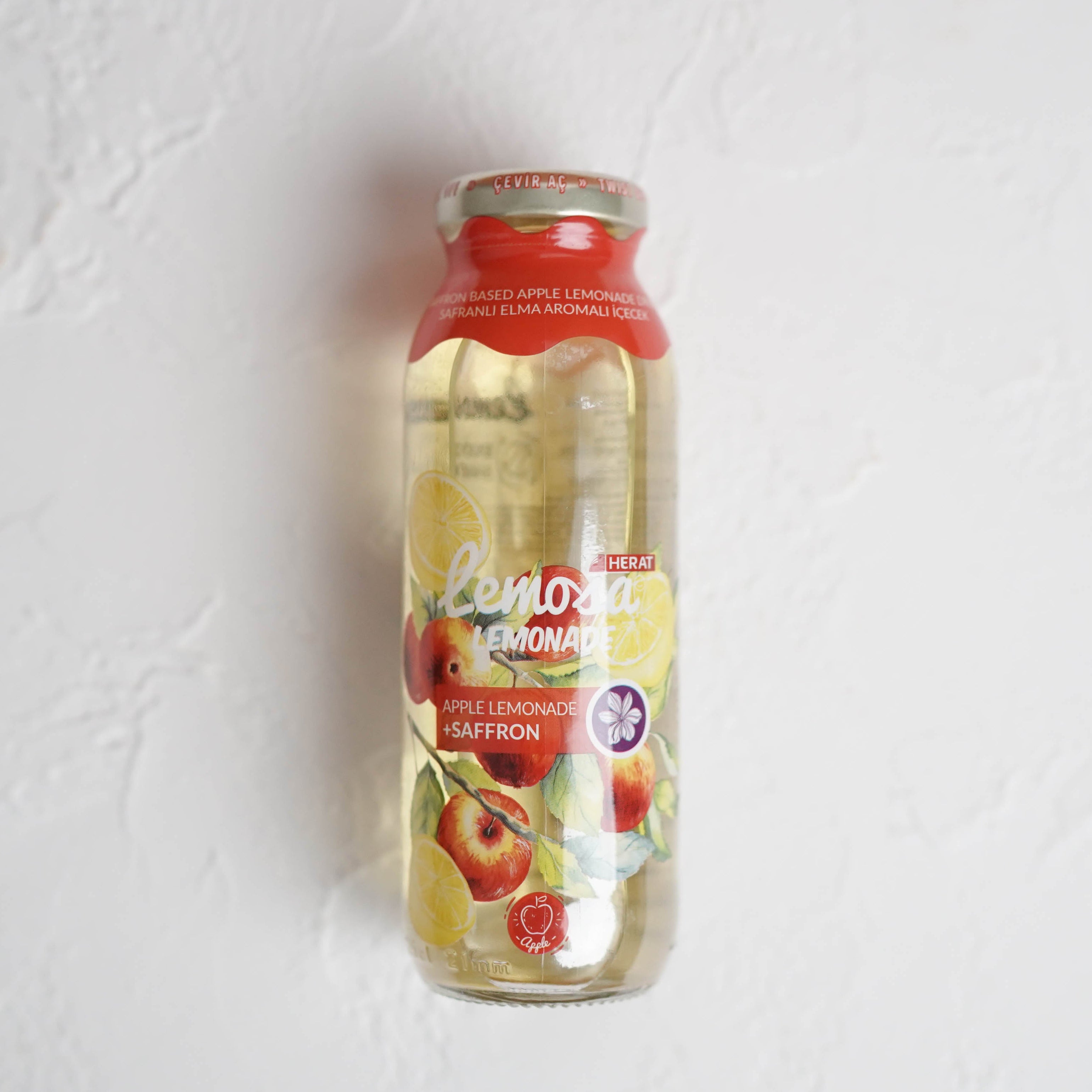 Bottle of lemonade on a light gray background