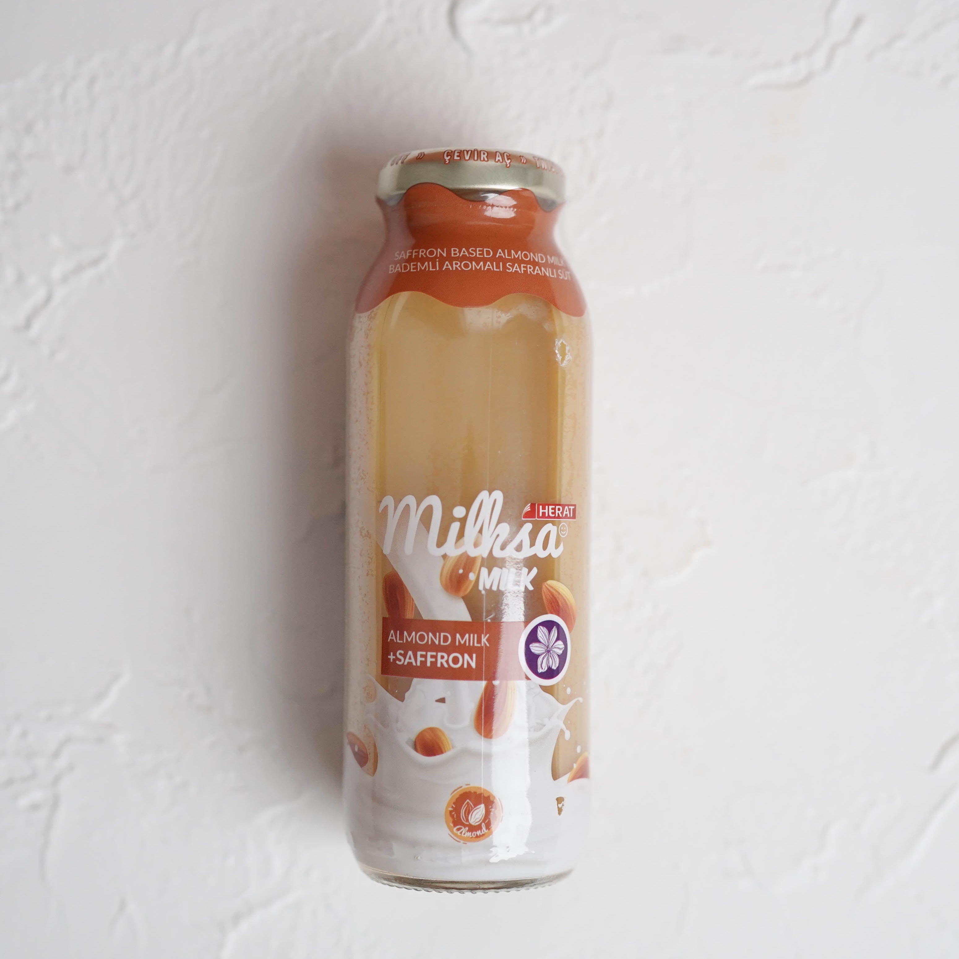 Bottle of Milka chocolate on a white background