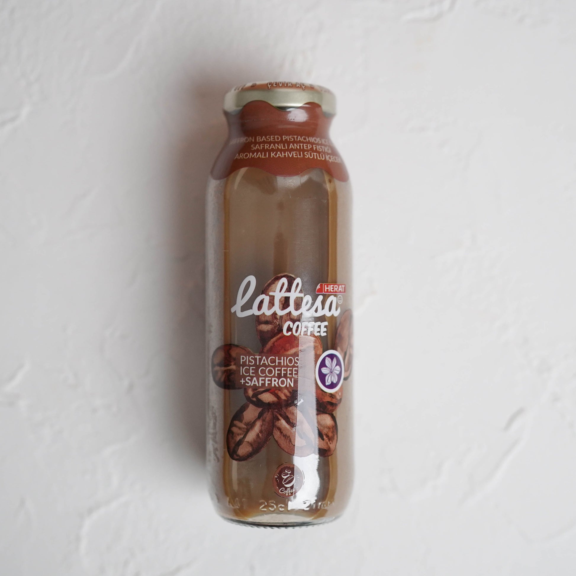 Bottle of Lattesa coffee on a textured white background
