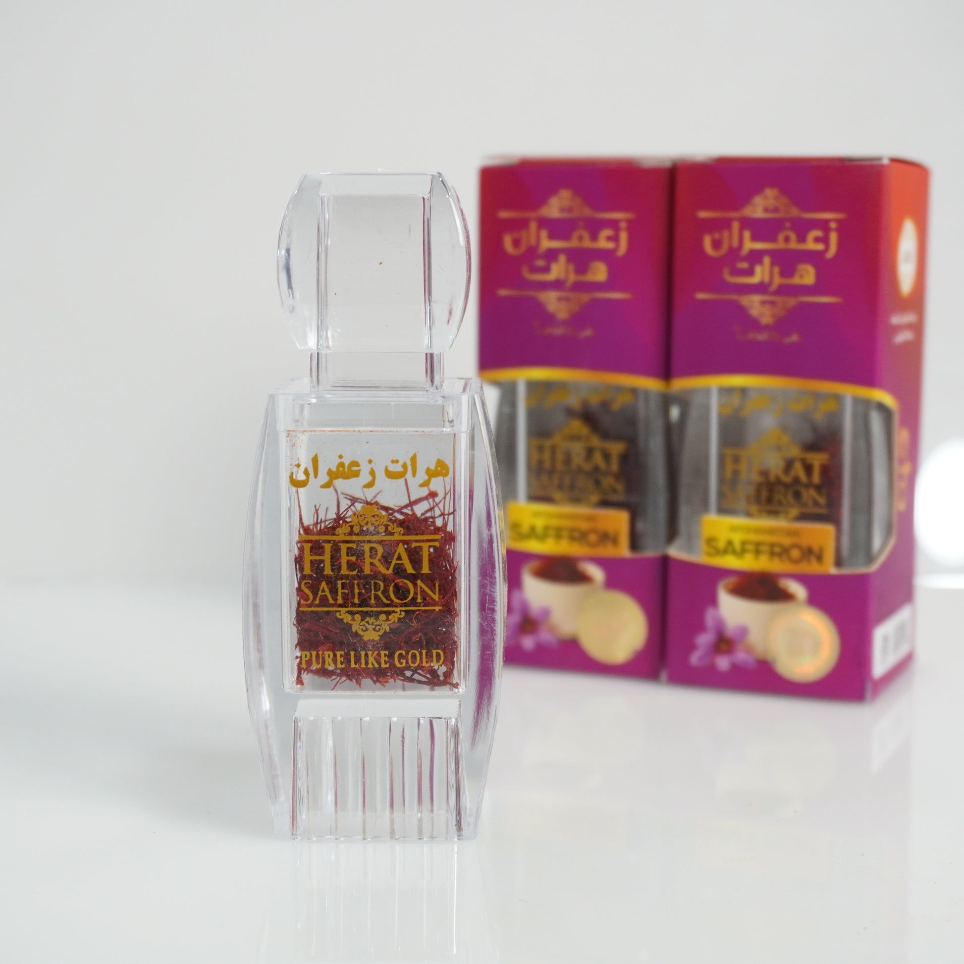 Herat Saffron packaging with a clear container on a white background