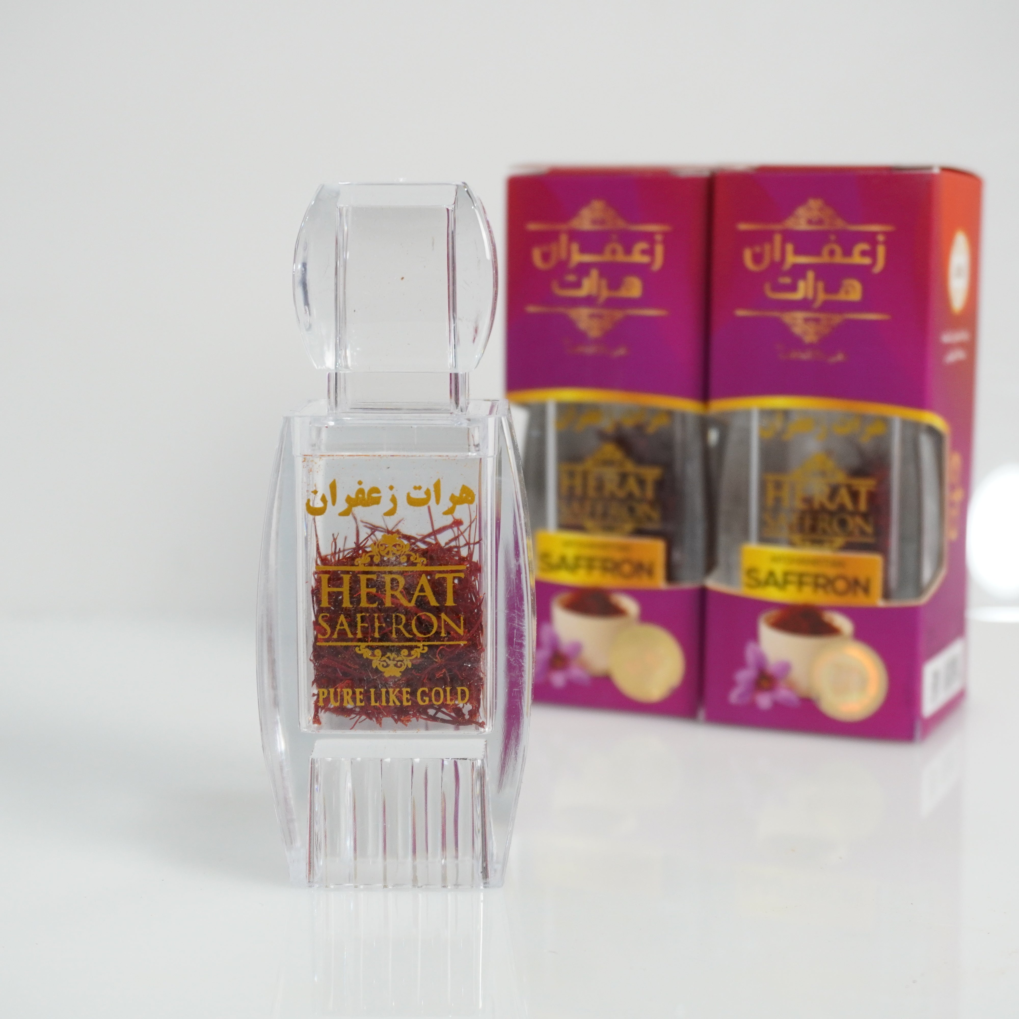 Herat Saffron packaging with a clear container on a white background