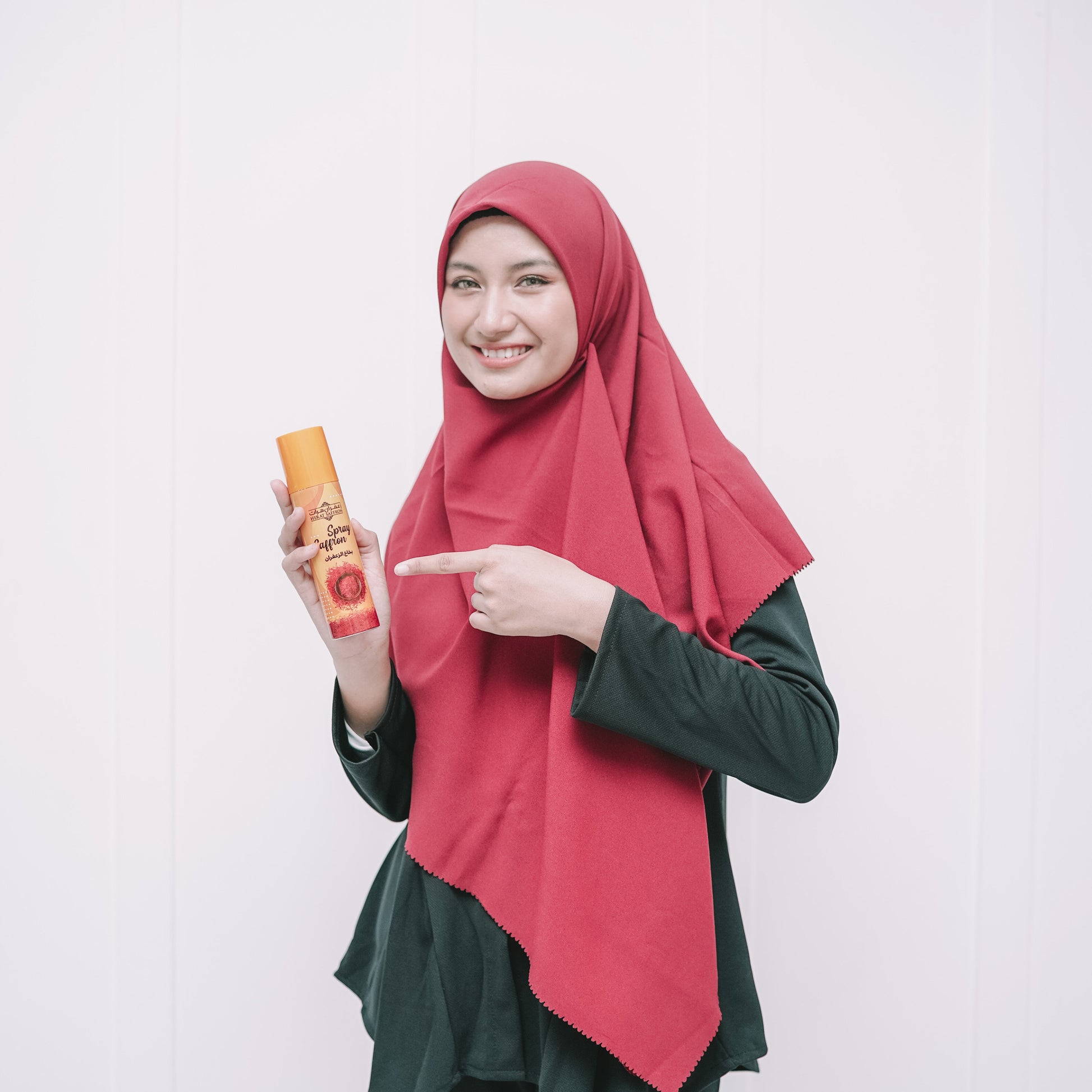 Woman pointing to a product on a white background