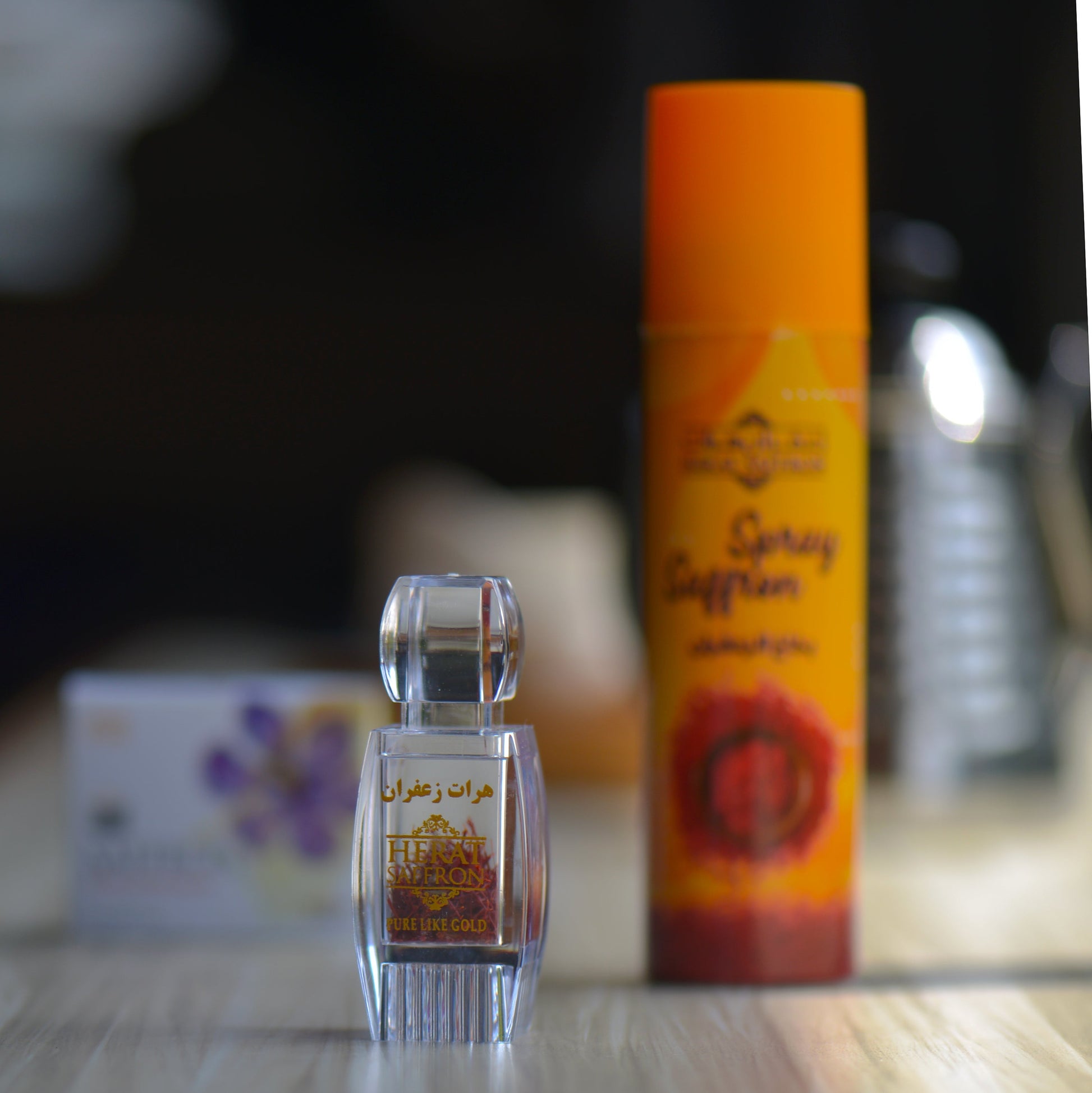 Small glass bottle with a colorful label on a reflective surface