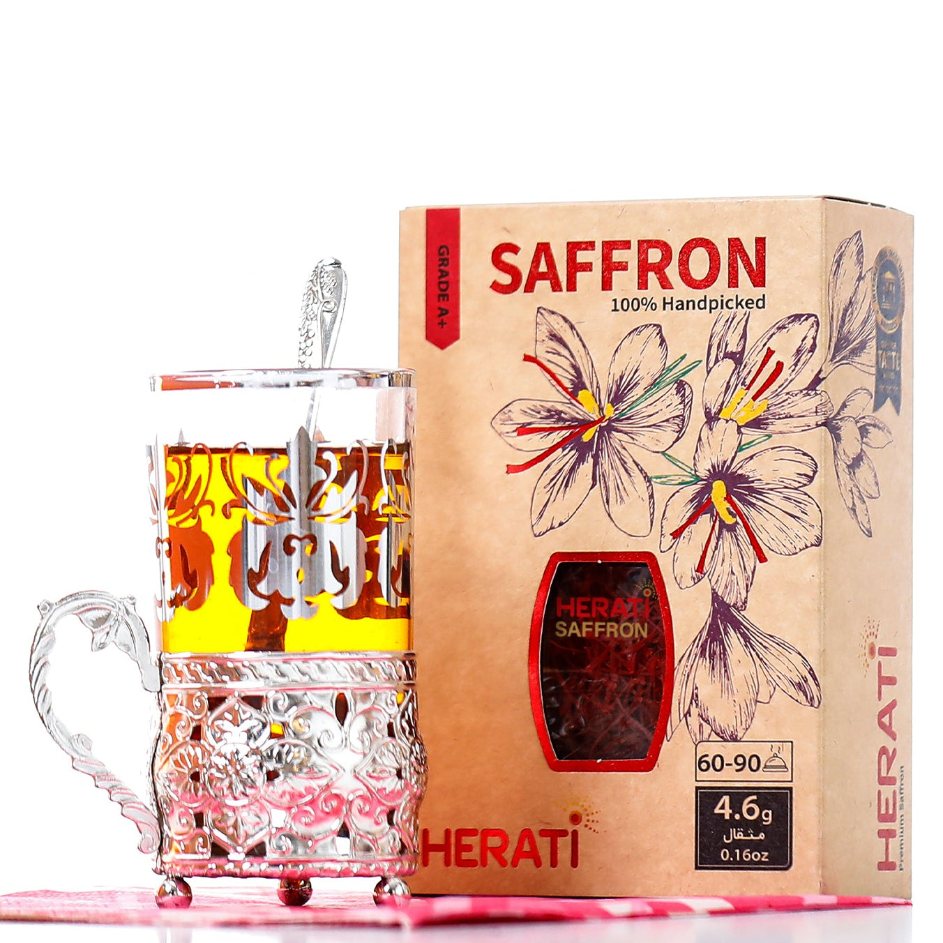 Ornate crystal tea glass beside Herati 4.6g Afghan saffron box with crocus artwork, handpicked Super Negin wholesale quality supporting women in Afghanistan